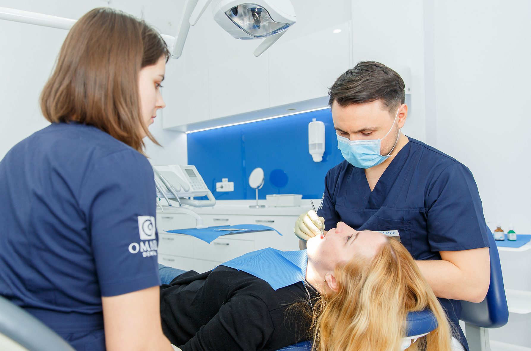 Doctor treating a patient with gum disease